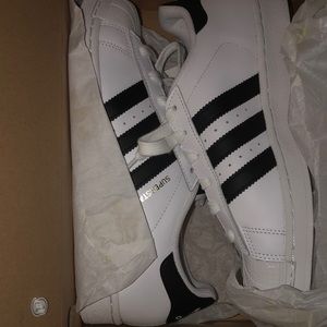 Black and white superstar Adidas shoes
